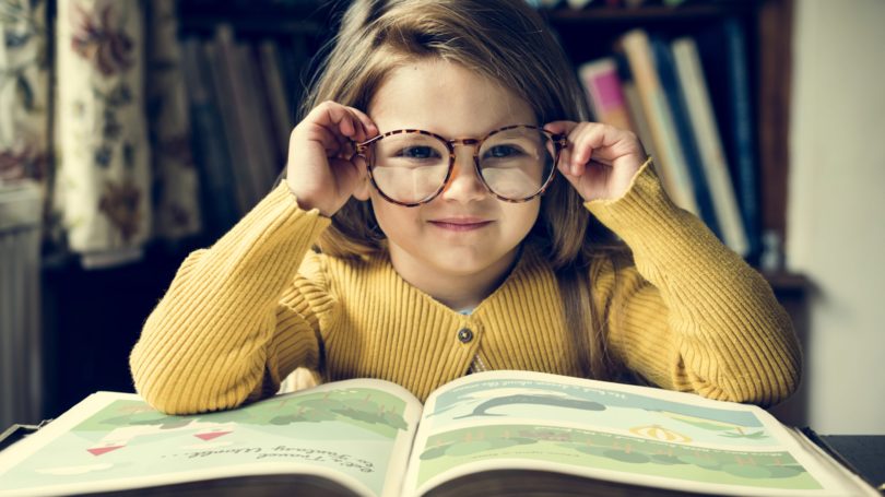 Cute Girl Glasses Reading Picture Book