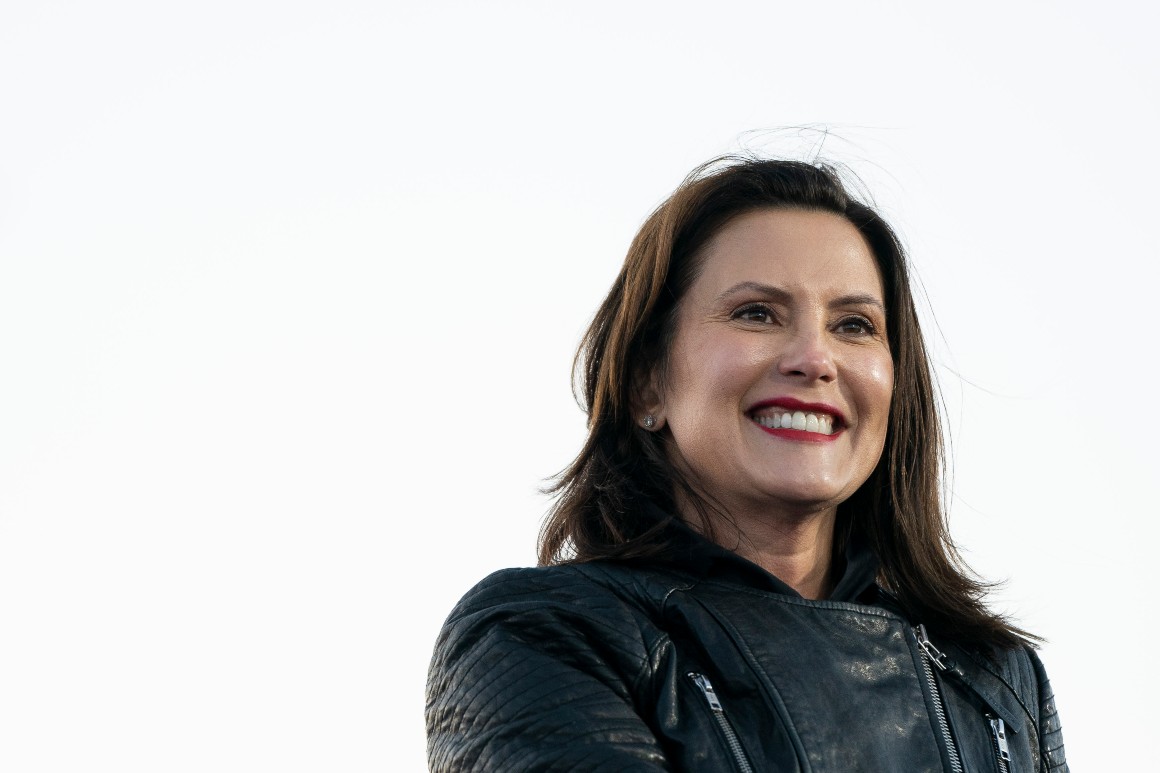 Gov. Gretchen Whitmer speaks during a drive-in campaign rally. 