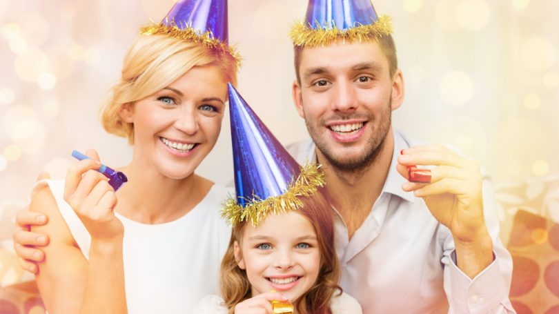 Family Dressed Up For New Year Party Celebration