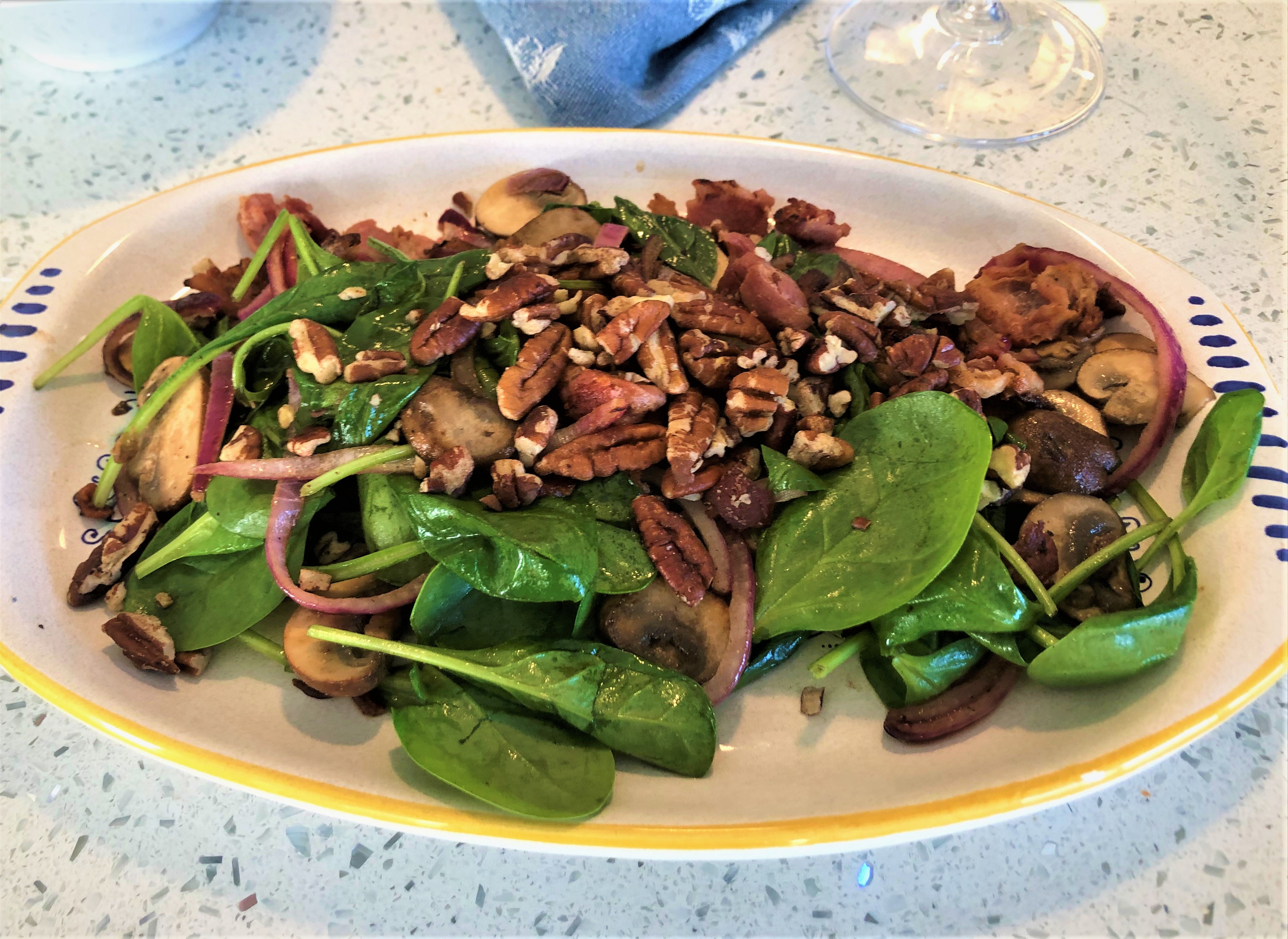 Bacon adds depth of flavour to a warm spinach salad prepared with red onions, mushrooms and pecans. - Mark DeWolf