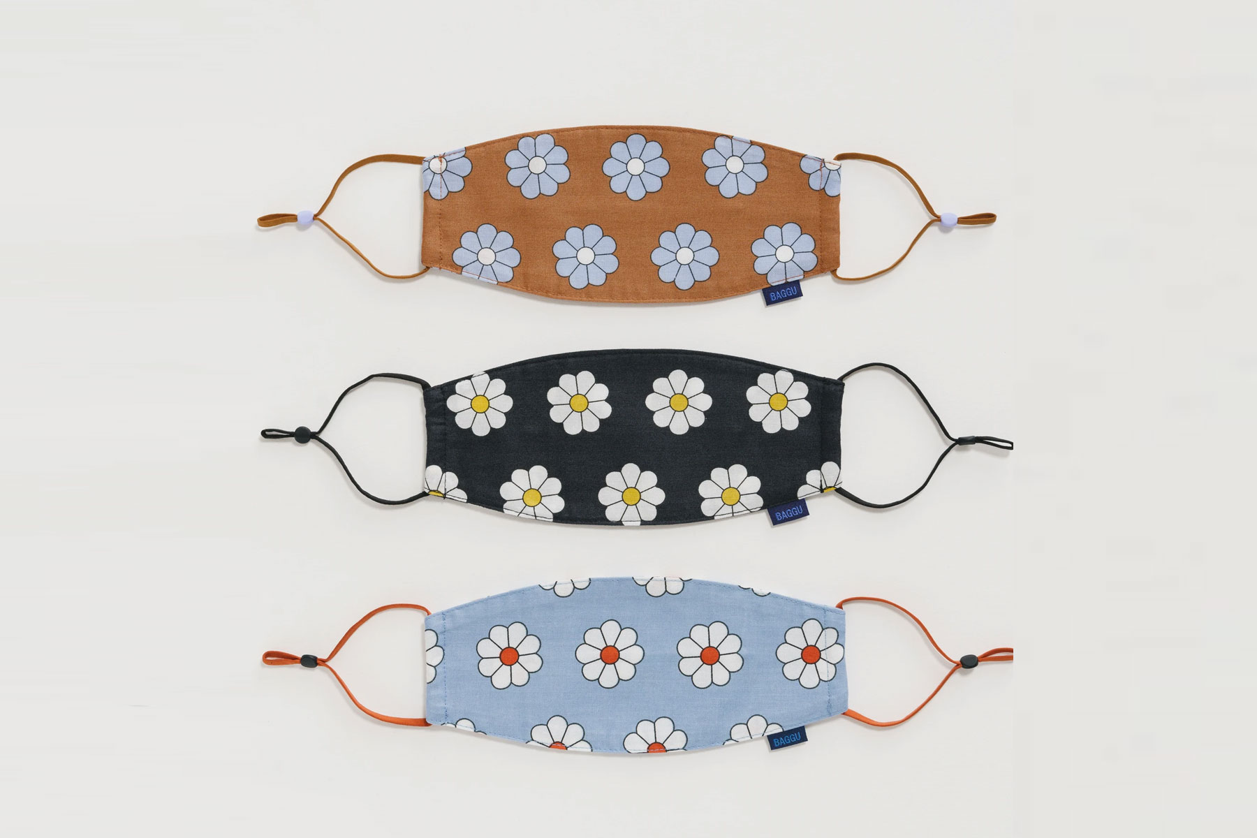 Three daisy printed face masks